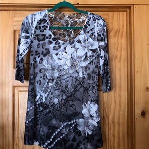 Gray and white shirt with crystal accents.